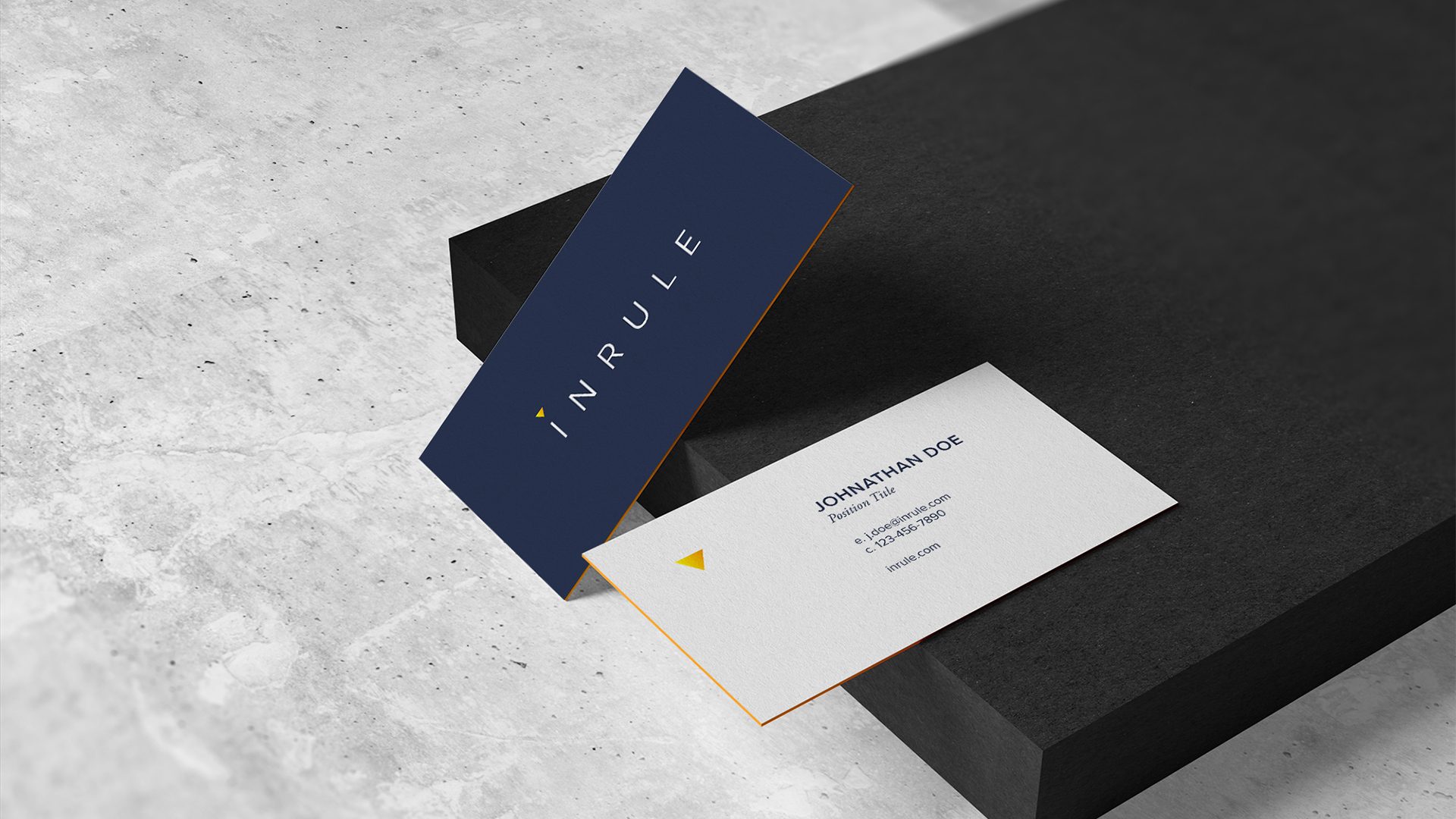 InRule business card, navy with the gold edge